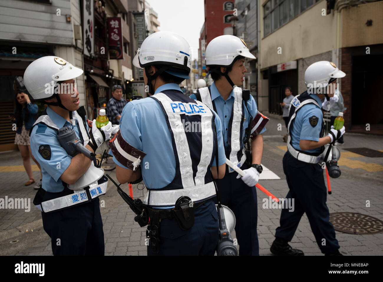 MAY 16, 2018 - Police direct traffic during the Wakamiya Hachiman-sha ...