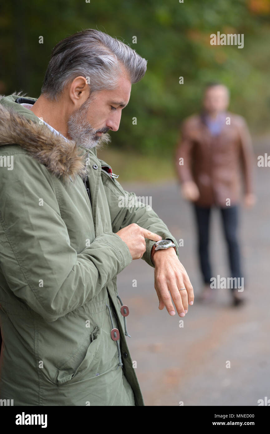 man watching his clock Stock Photo - Alamy