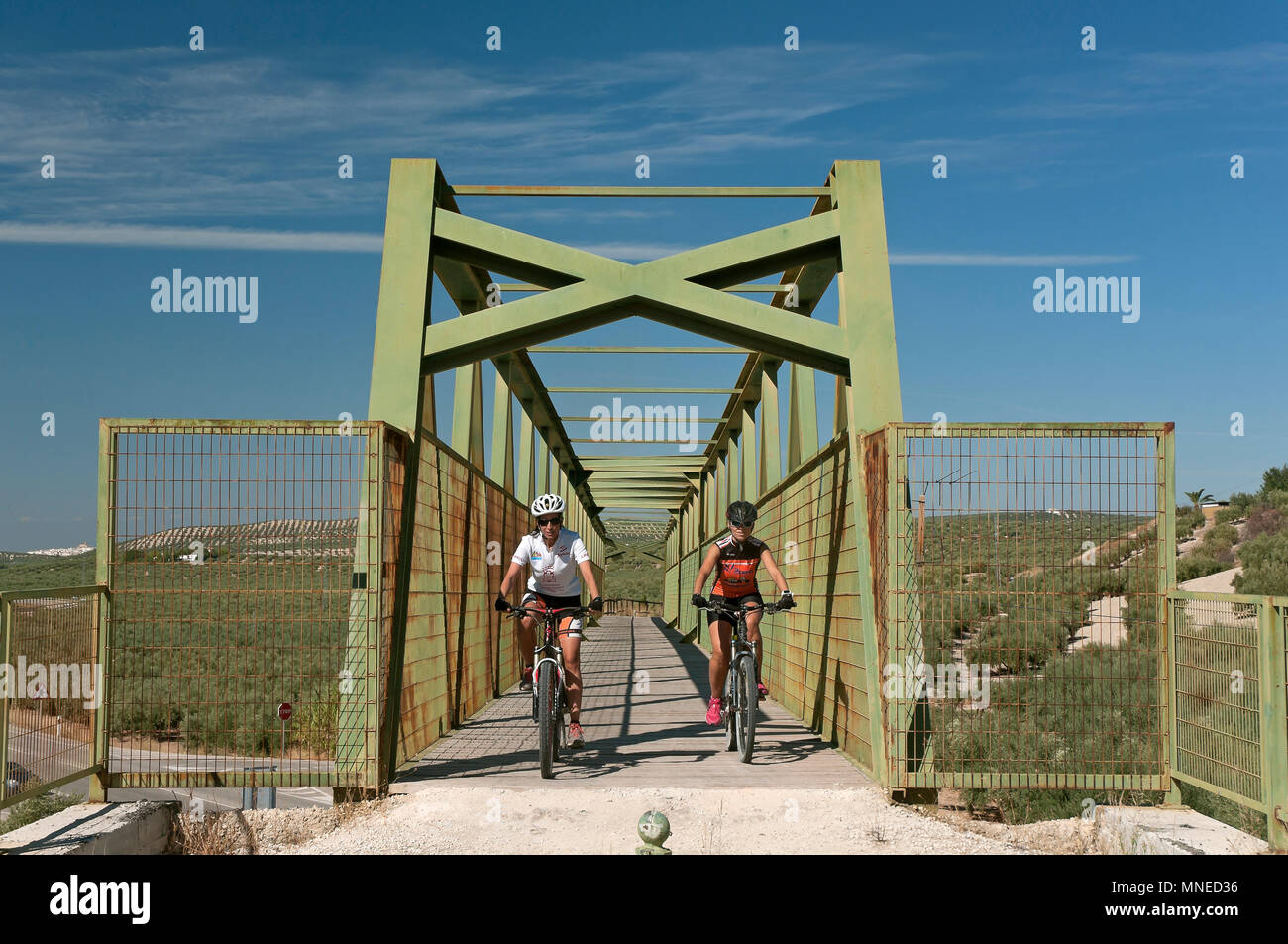 Greenway of the Subbetica (old railway line of the so-called 'oil train') - footbridge over the road and cyclists. Luque. Cordoba province. Region of  Stock Photo