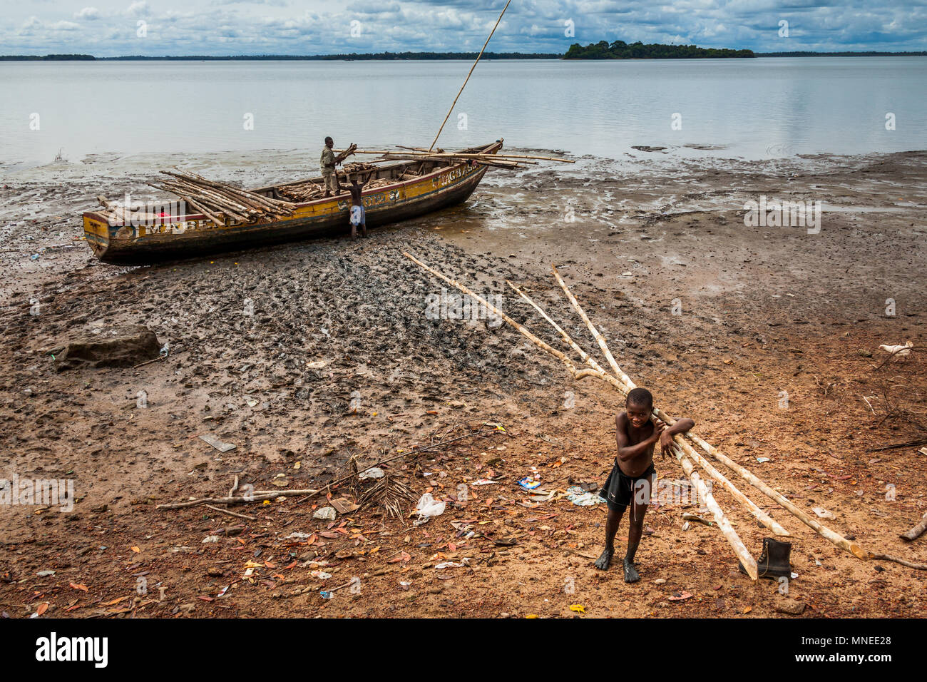 Bunce Island, Sierra Leone - June 02, 2013: West Africa, unknown fisherman unloads the material from the dock, Bunce Island was a British slave tradin Stock Photo