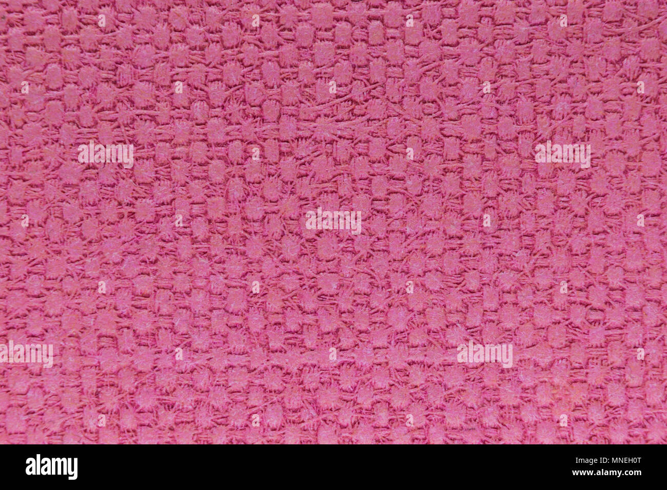 Pink plastic background surface with squares pattern Stock Photo