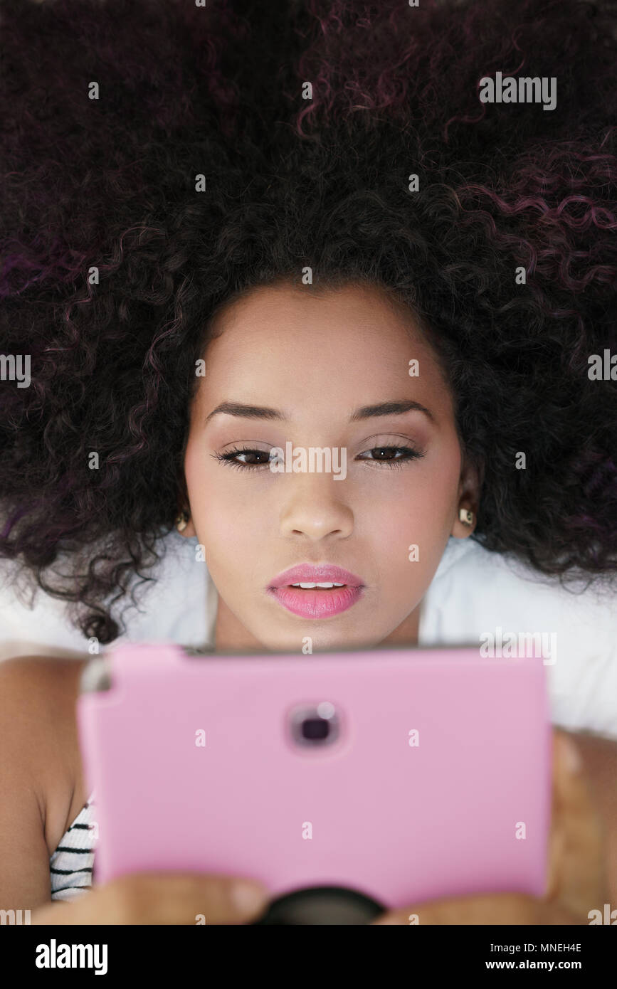 Teen girl reading tablet hi-res stock photography and images - Alamy