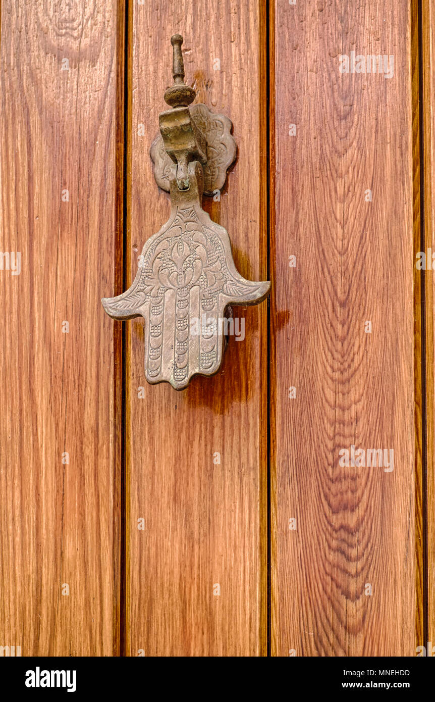 Fatima hand knocker on a wooden door Stock Photo Alamy