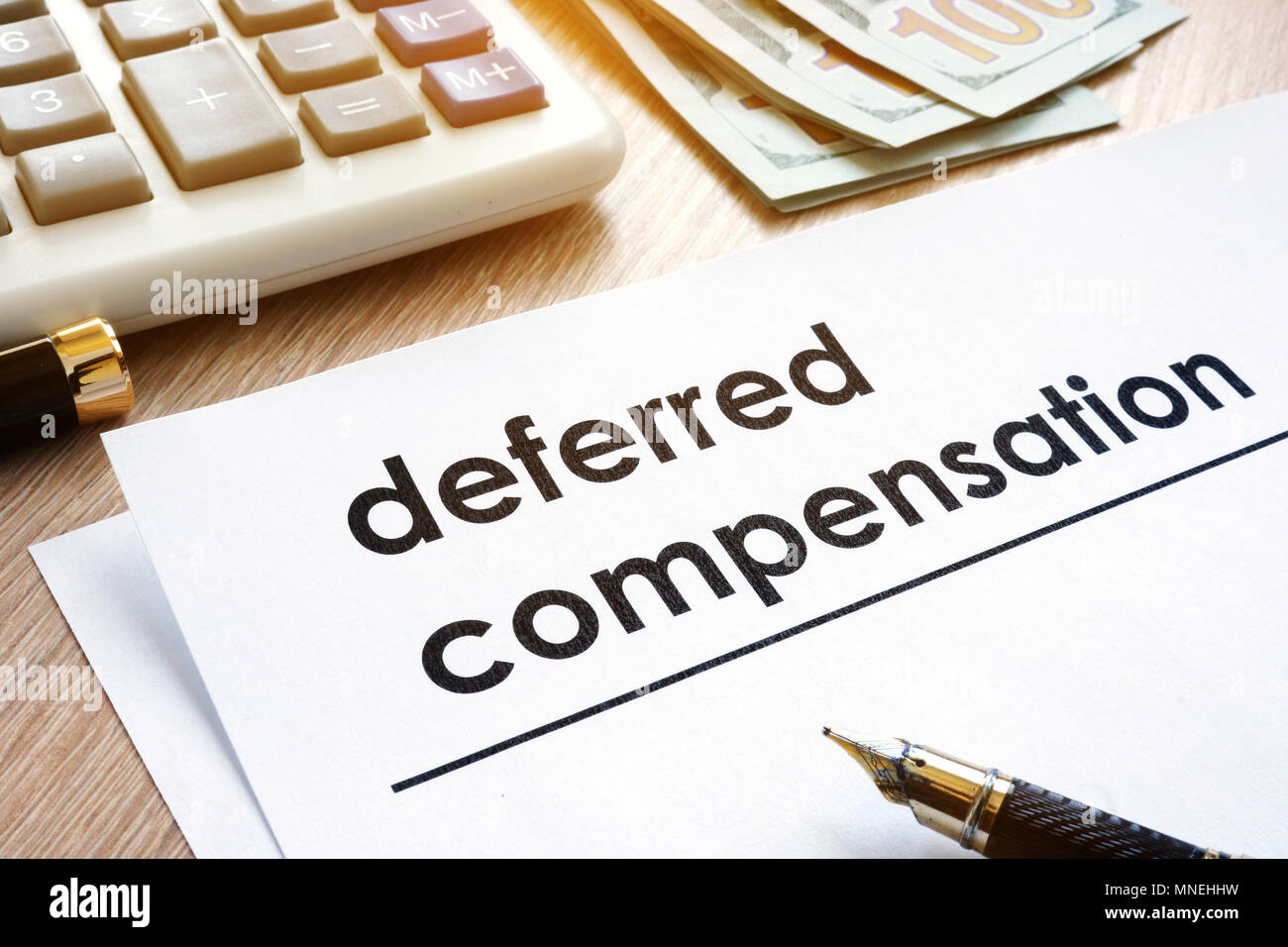Documents with title Deferred compensation and dollars. Stock Photo