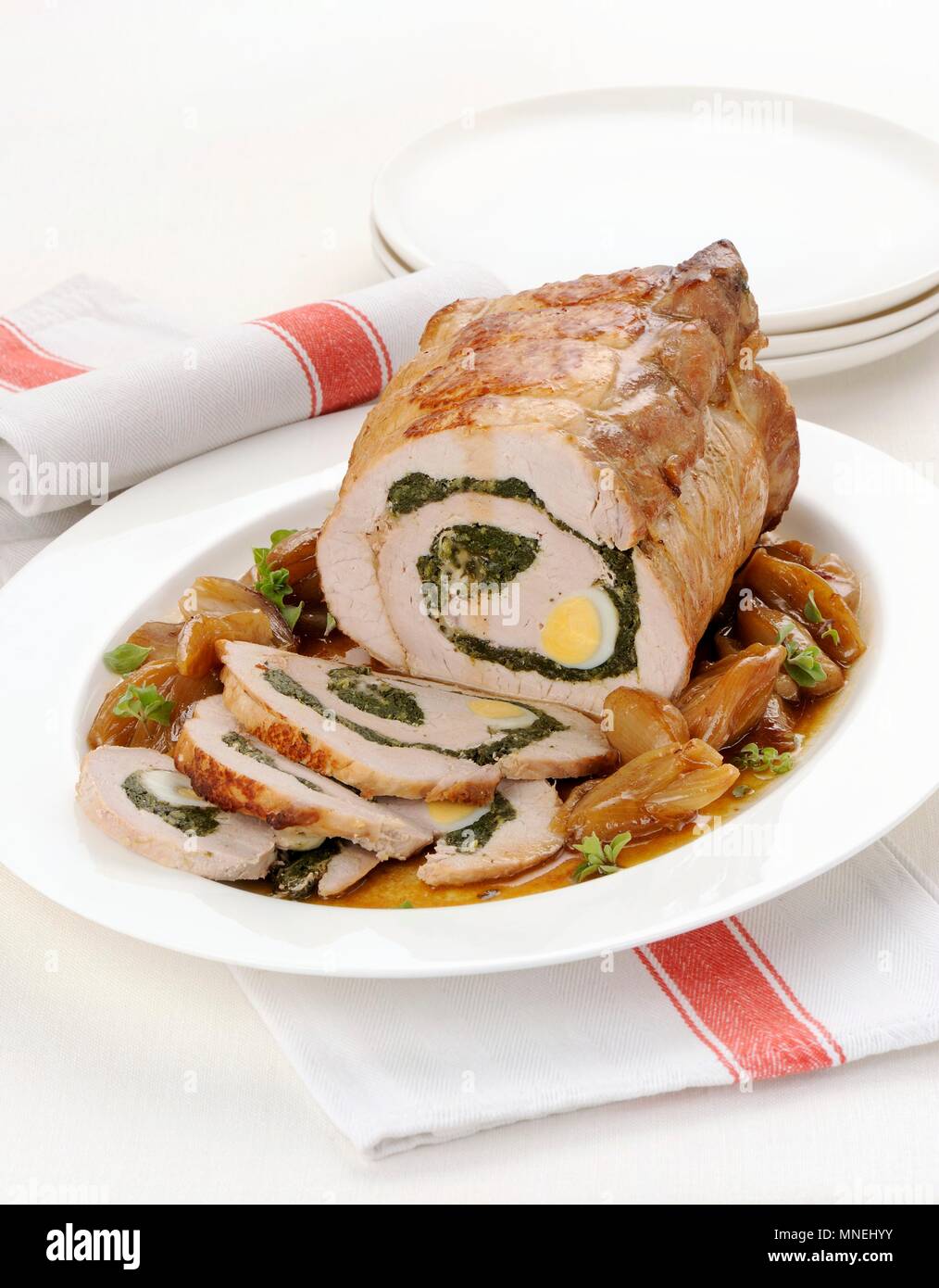 Pork roulade filled with herbs and eggs Stock Photo