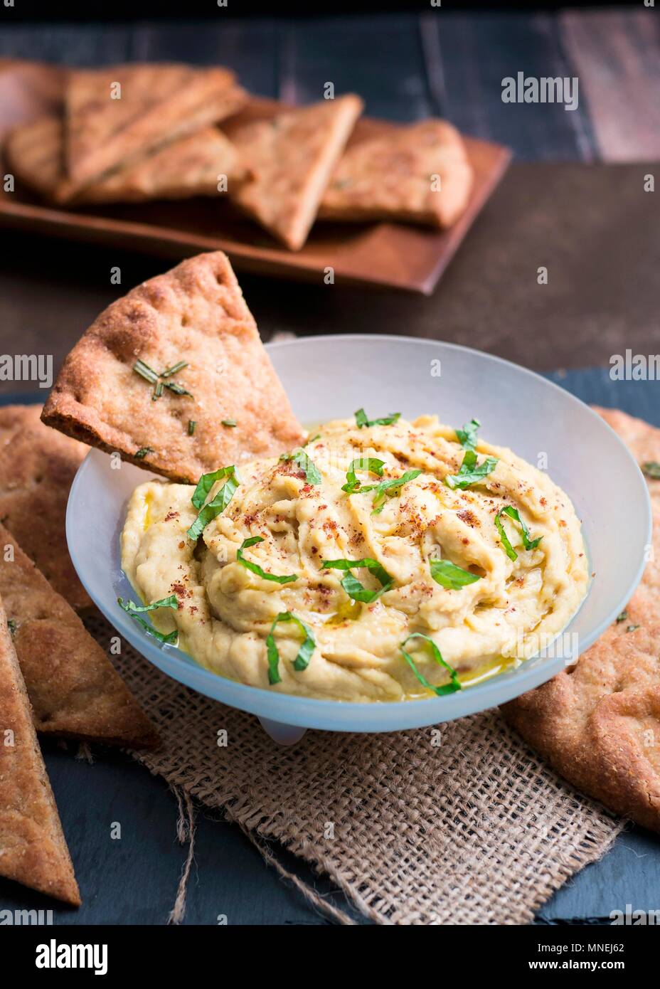 Hummus with flatbread crisps Stock Photo Alamy
