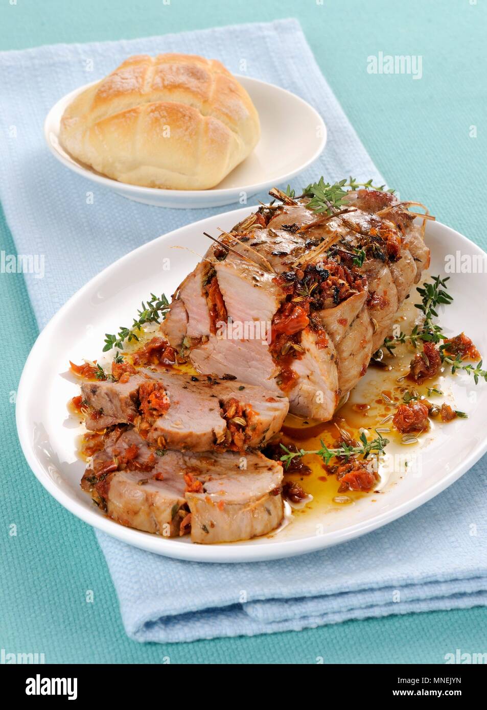 Pork fillet with dried tomatoes and thyme Stock Photo