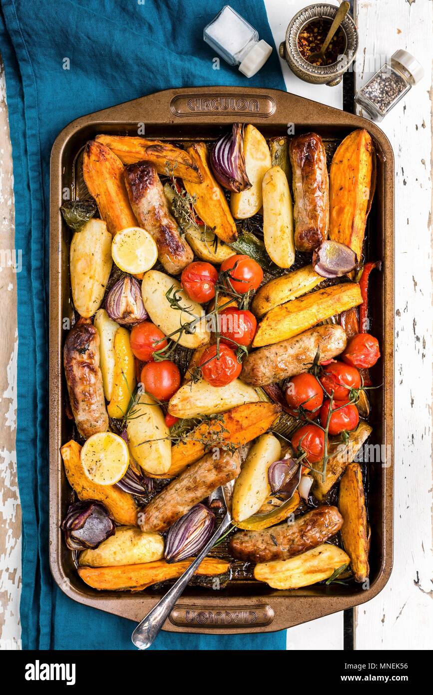Oven roasted vegetables with sausages Stock Photo Alamy