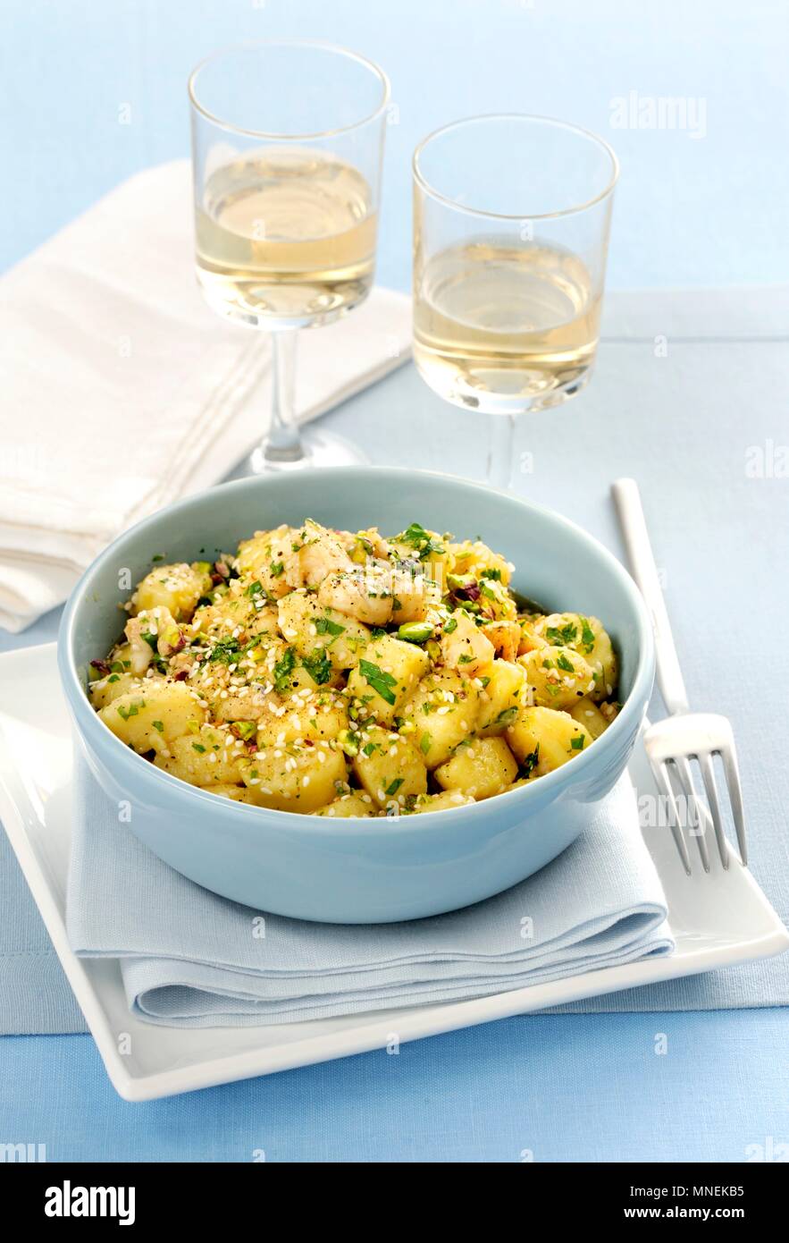 Gnocchi al ragù di mare (gnocchi with seafood ragout, pistachios and sesame seeds, Italy) Stock Photo