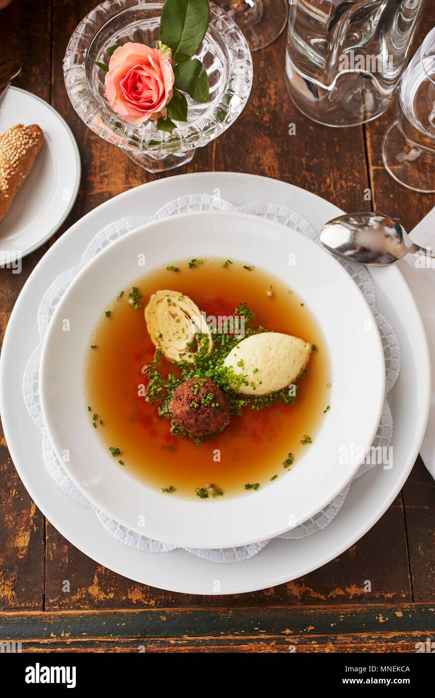 Beef broth with three different toppings liver dumpling, semolina