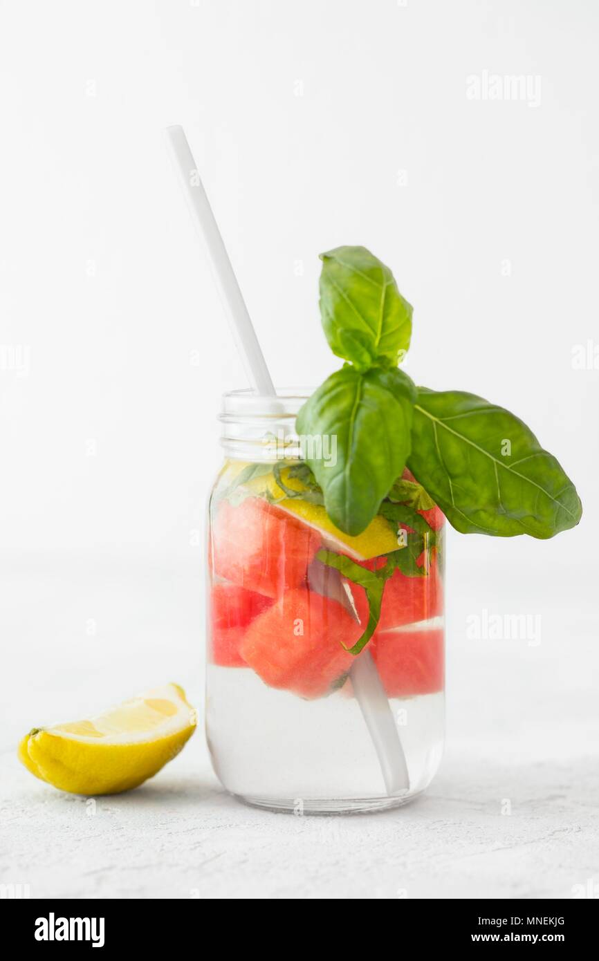 Detox water with melon, lemon and basil Stock Photo