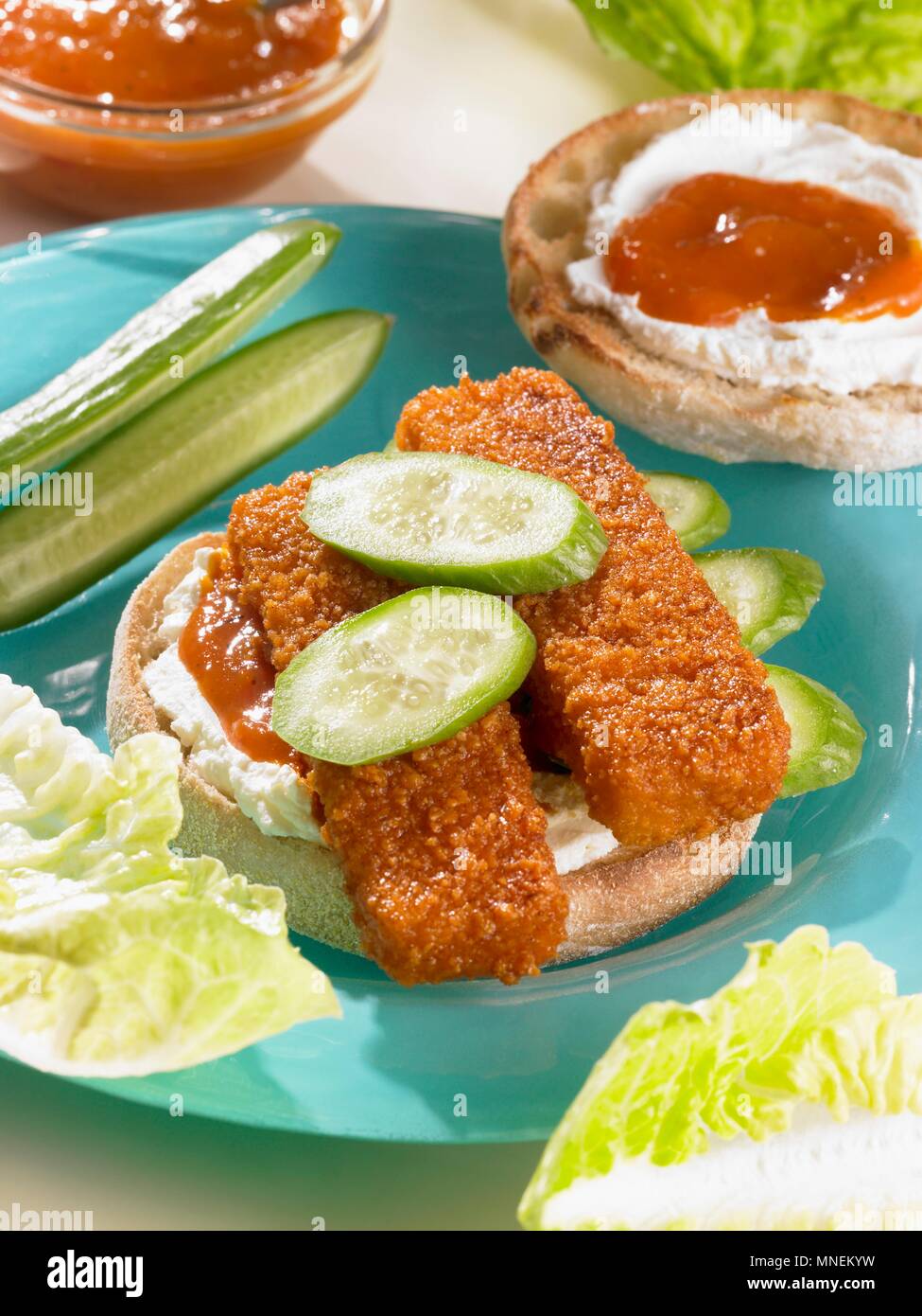 A fish finger sandwich with cream cheese and cucumber Stock Photo