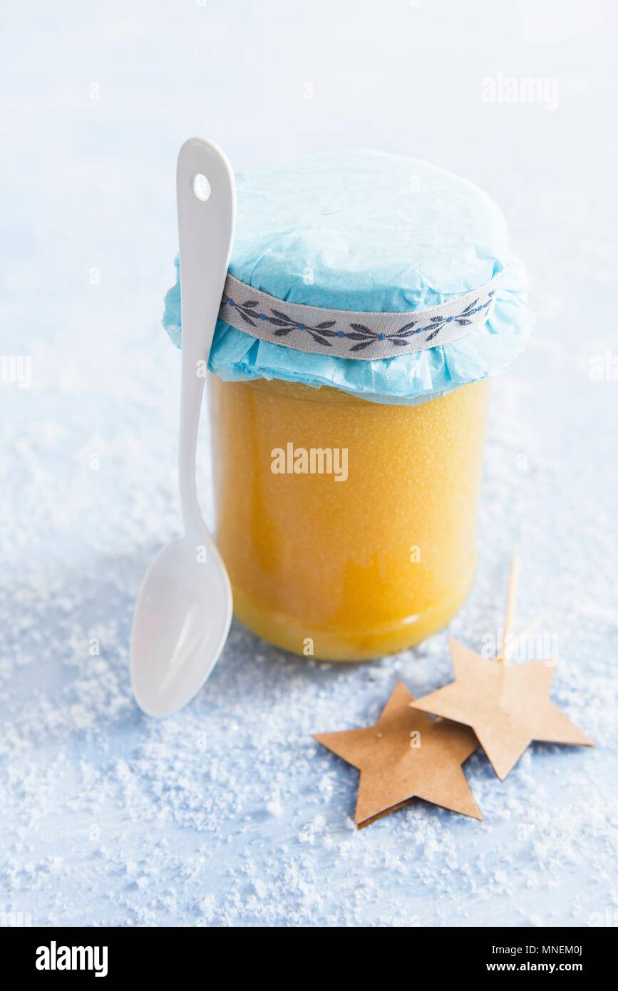 Lemon curd in a glass jar as a gift Stock Photo