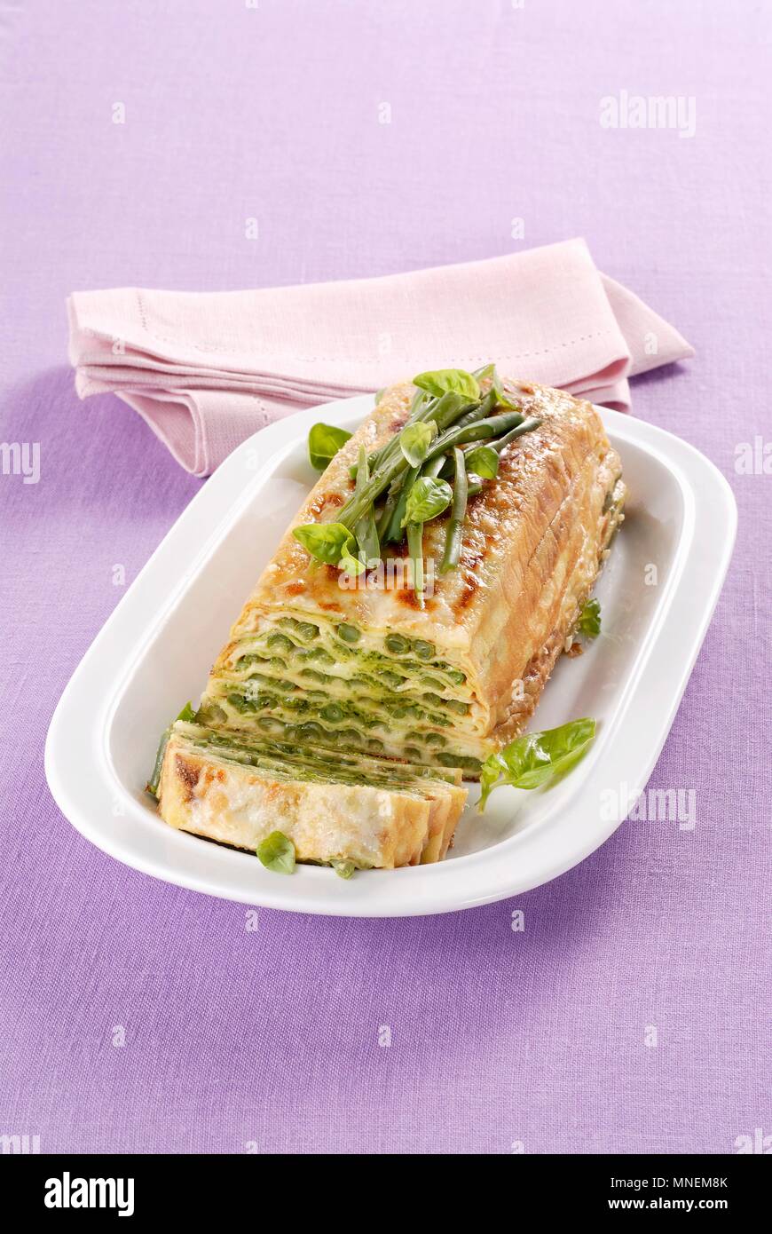 Pancake terrine with pesto and green beans Stock Photo