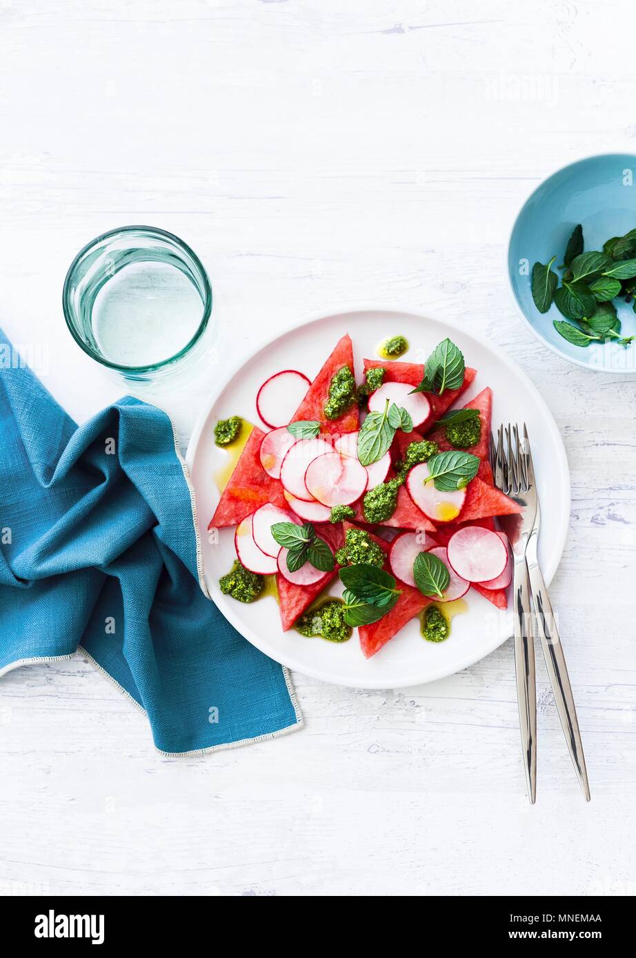 Watermelon salad with radishes, pesto and peppermint Stock Photo