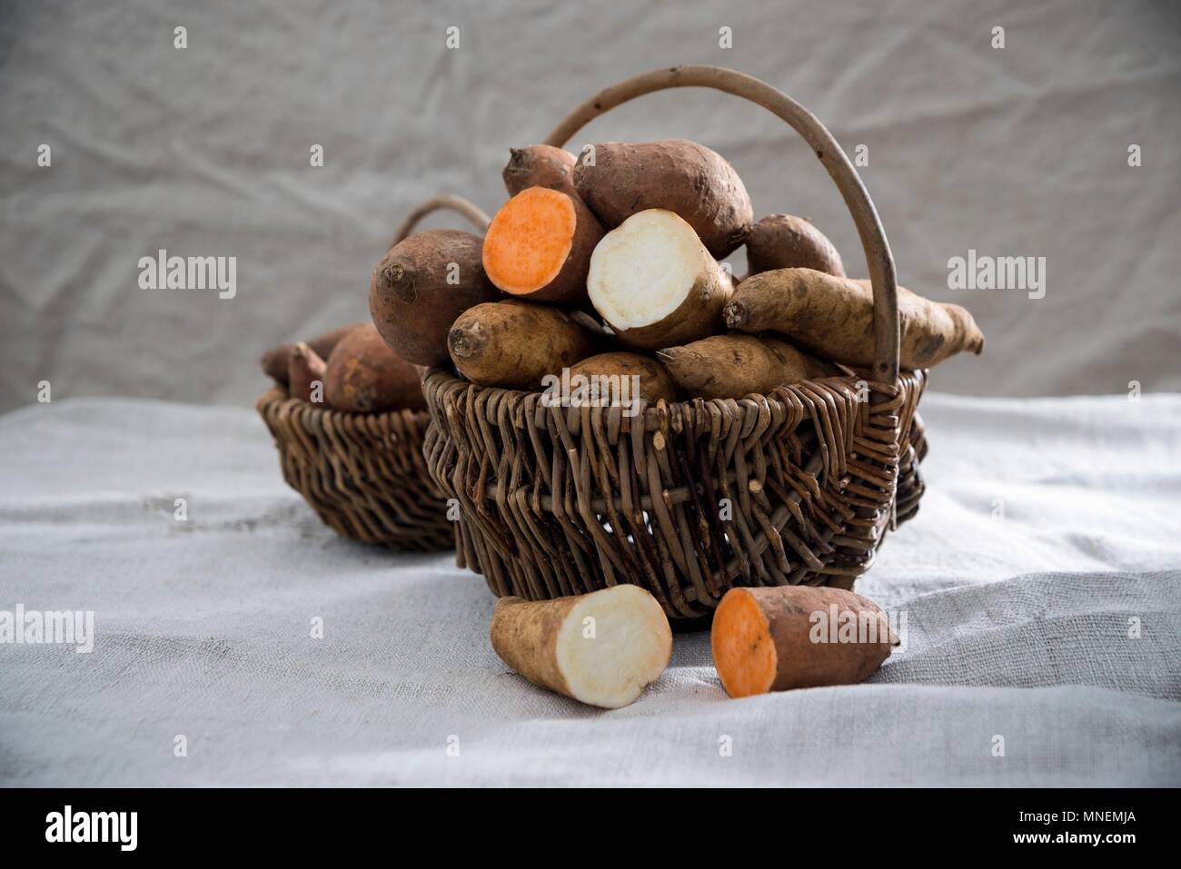 White and red sweet potatoes in a basket Stock Photo