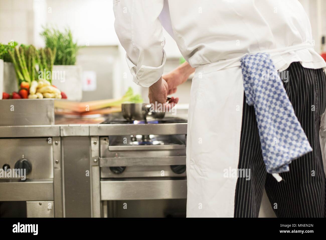 A professional chef at a stove Stock Photo Alamy