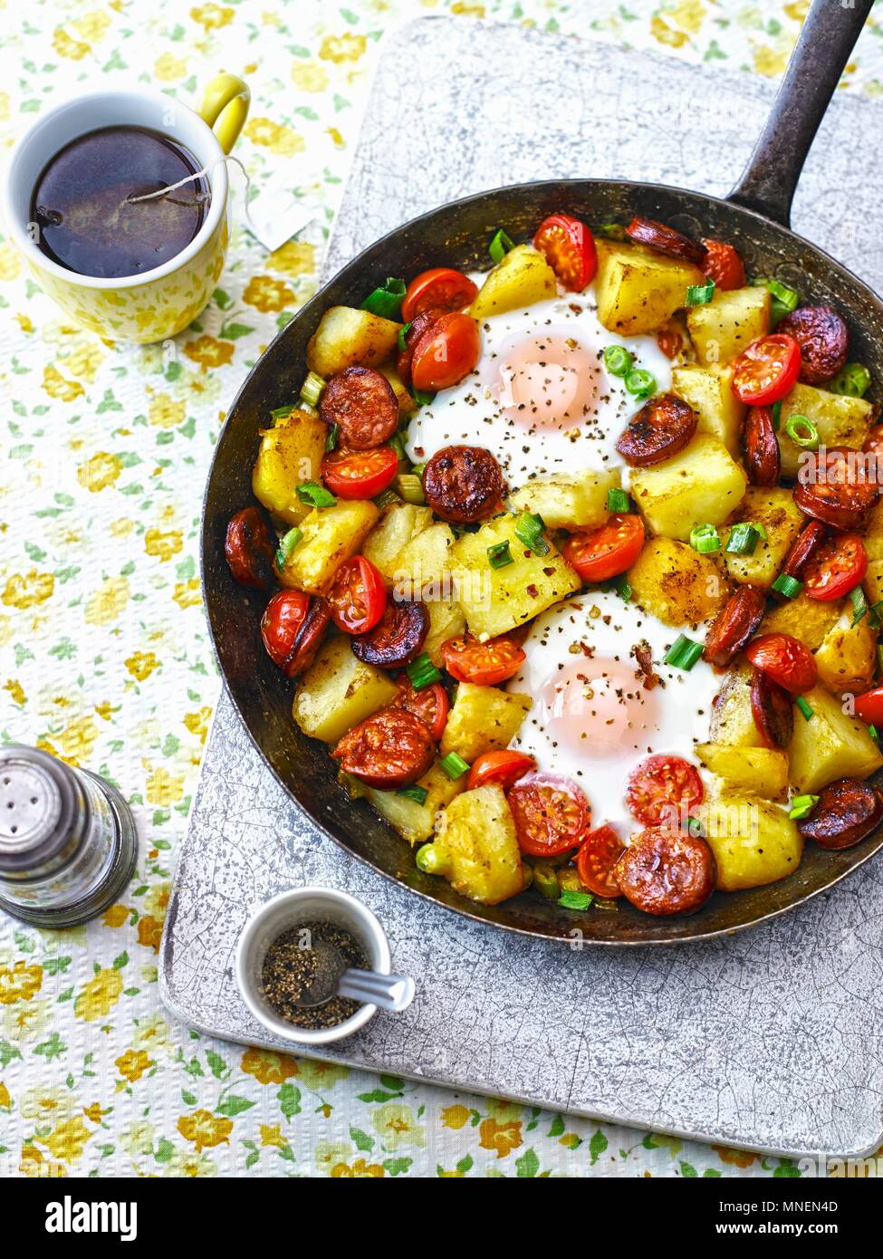 Baked eggs, chorizo, potatoes and tomatoes Stock Photo Alamy