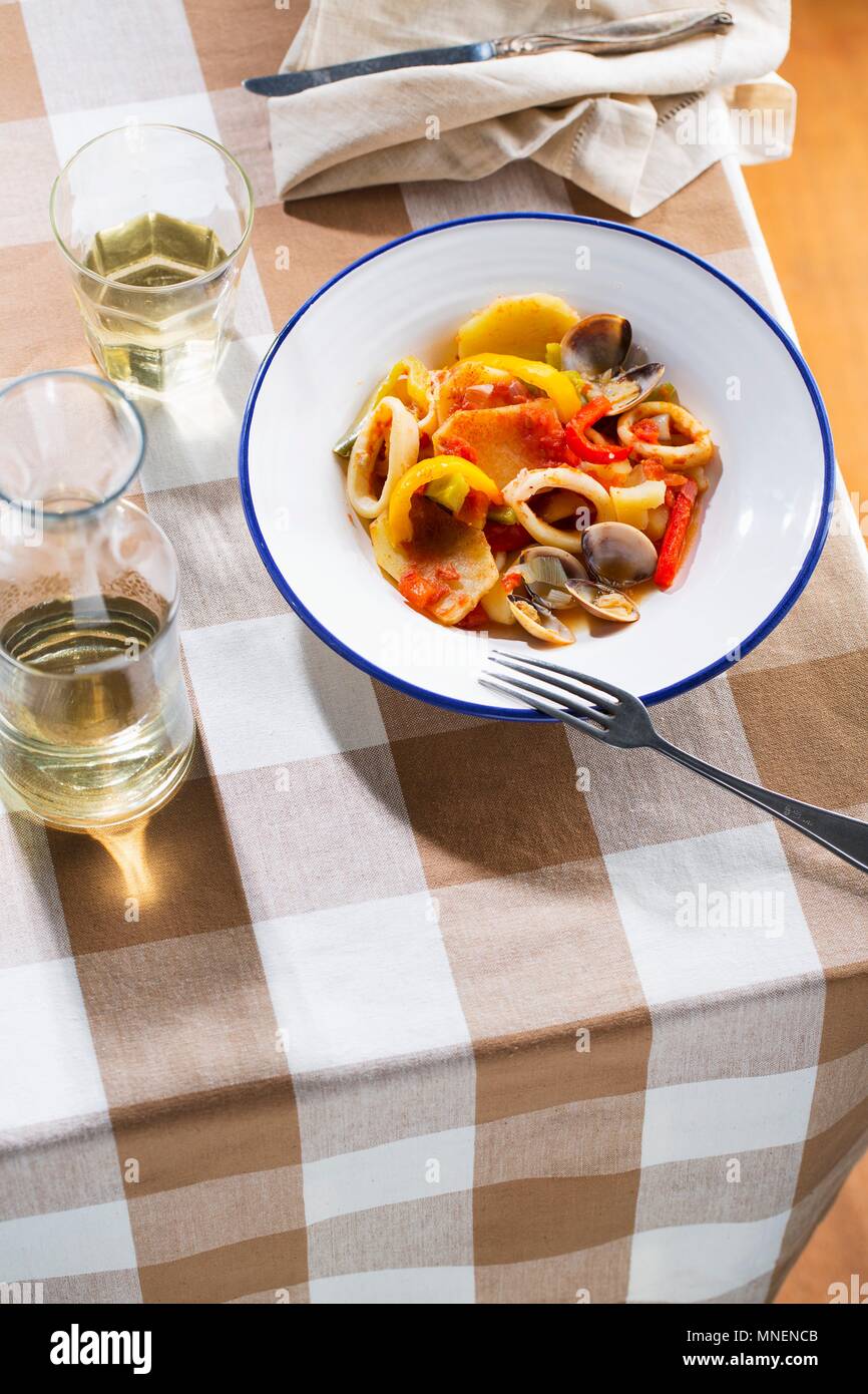 Fish stew with squid and mussels Stock Photo Alamy