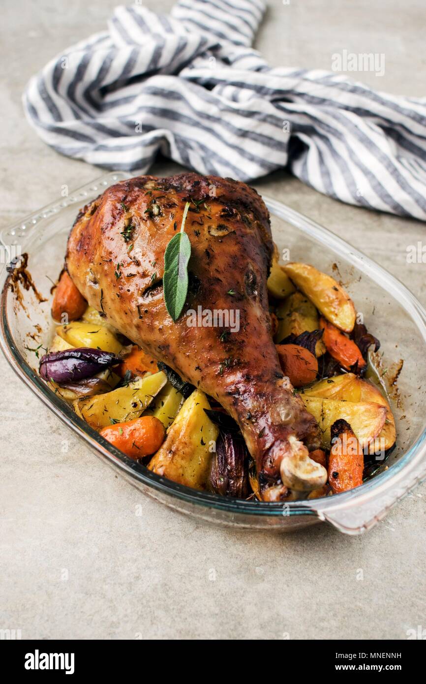 Roast leg of turkey with vegetables Stock Photo