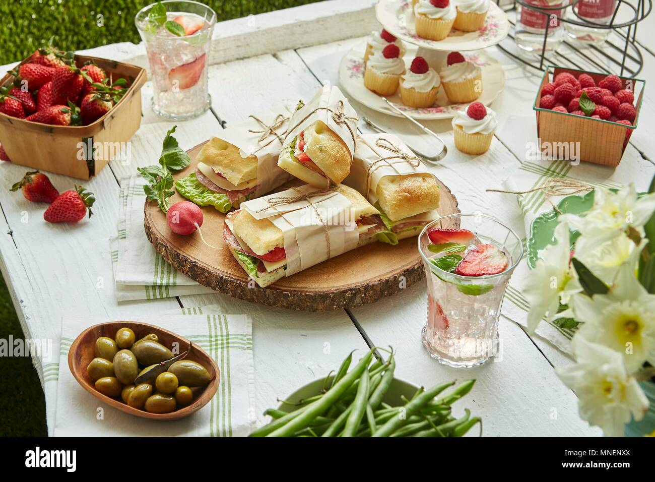 Sandwiches, salads, fruit and cupcakes for a picnic Stock Photo