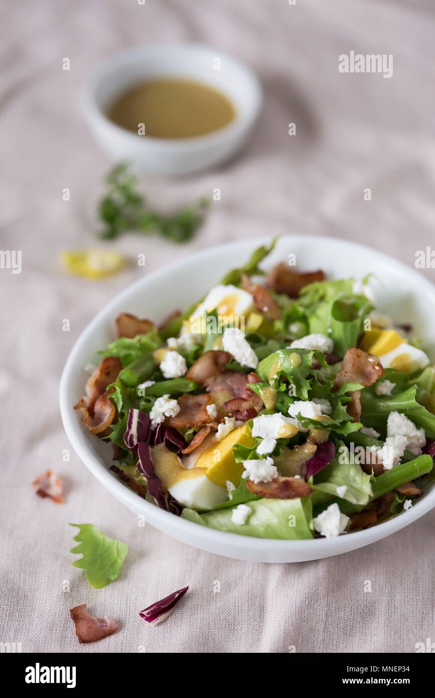 Asparagus salad with eggs, bacon and feta cheese Stock Photo