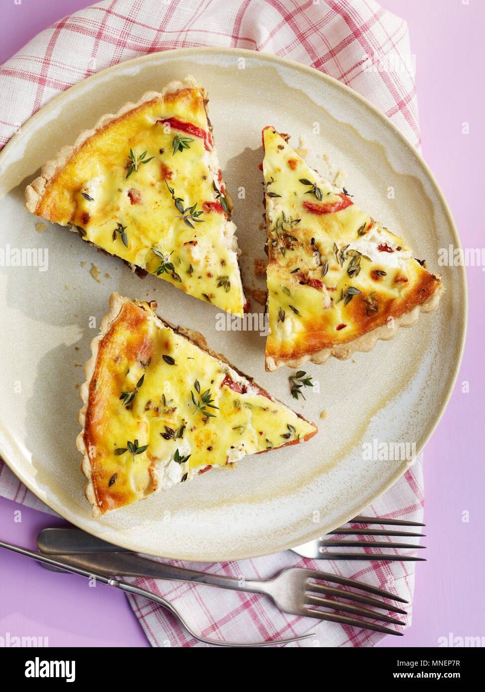 Three slices of herb quiche with bacon Stock Photo - Alamy