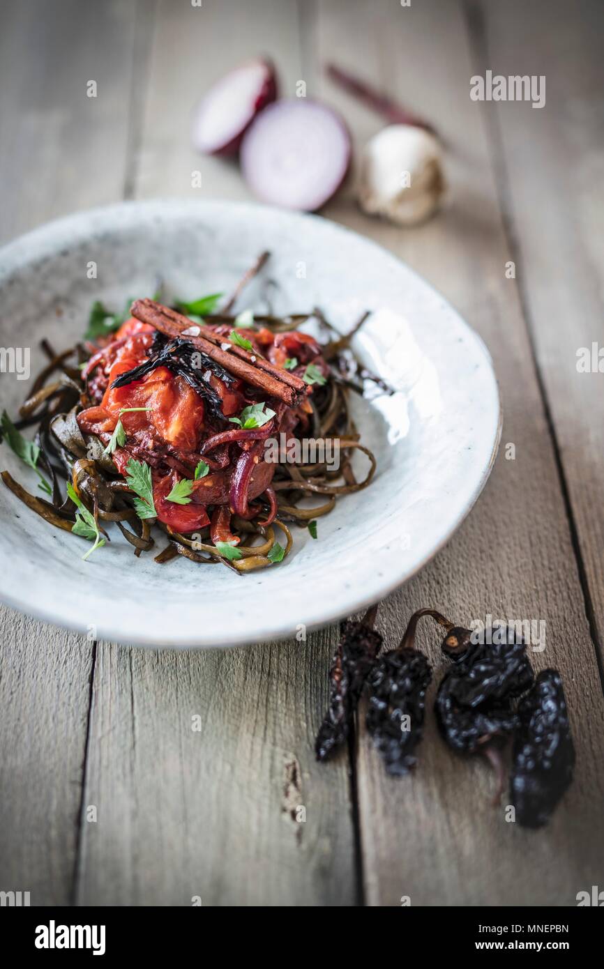 Seaweed pasta with smoked chilli Stock Photo