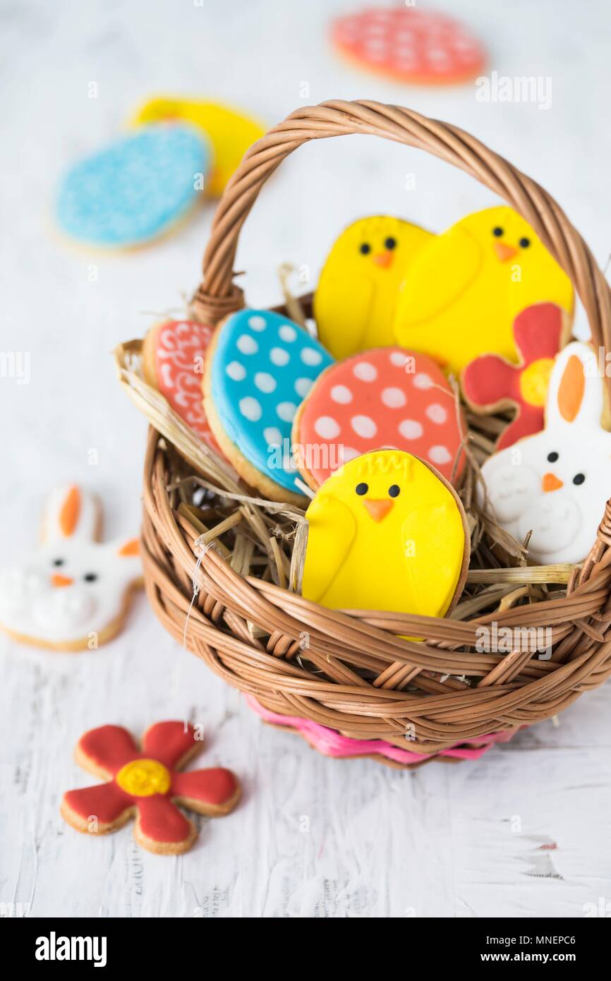 Colourful Easter biscuits in a basket Stock Photo