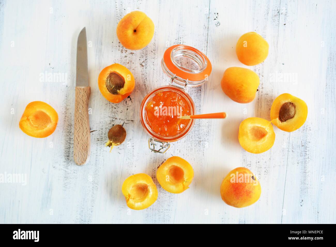 A jar of apricot jam and apricots Stock Photo