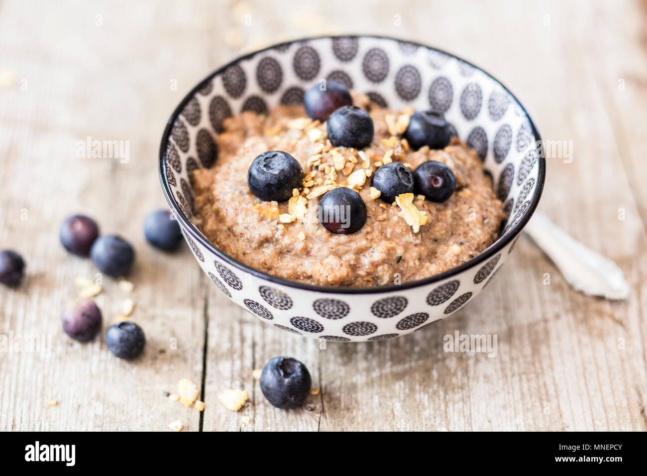 Lupine porridge with dried fruits and blueberries Stock Photo