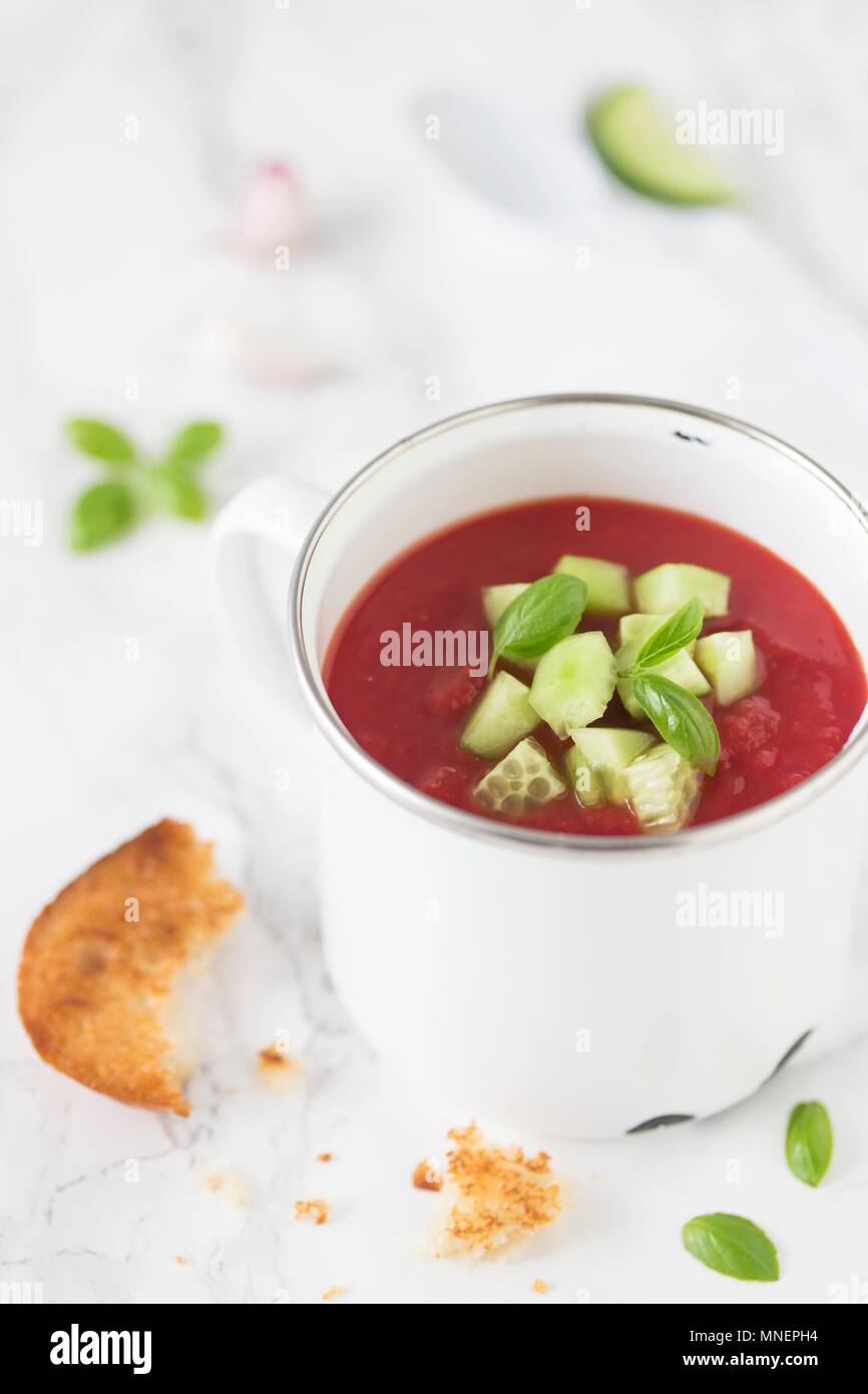 Tomato gazpacho with sliced cucumber and toast Stock Photo Alamy