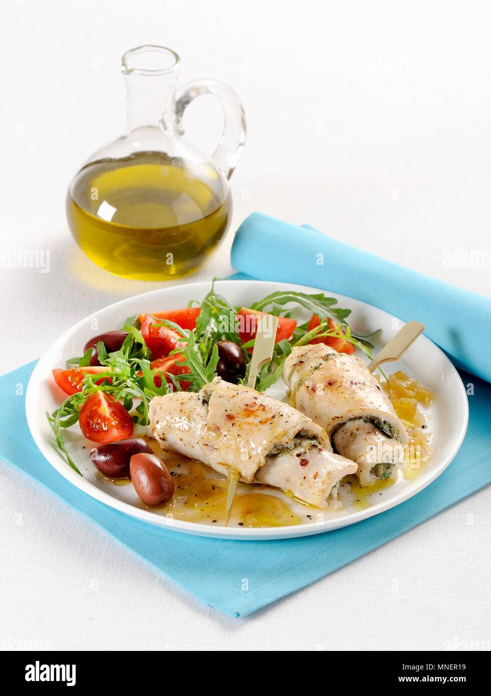 Swordfish and pesto rolls with a tomato and rocket salad Stock Photo