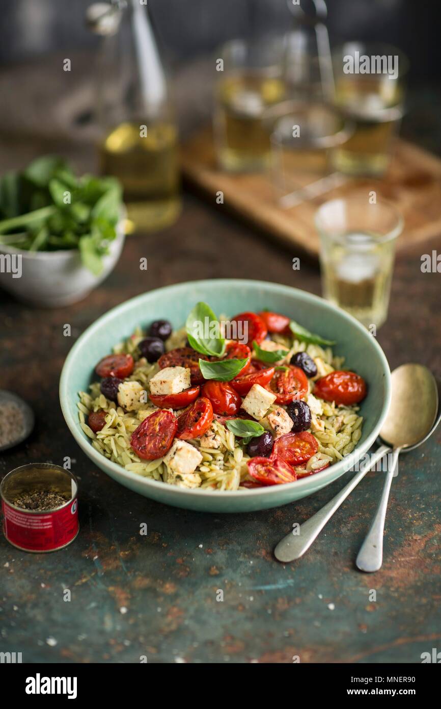 Rosemary pasta with fried tomatoes, feta and olives Stock Photo Alamy
