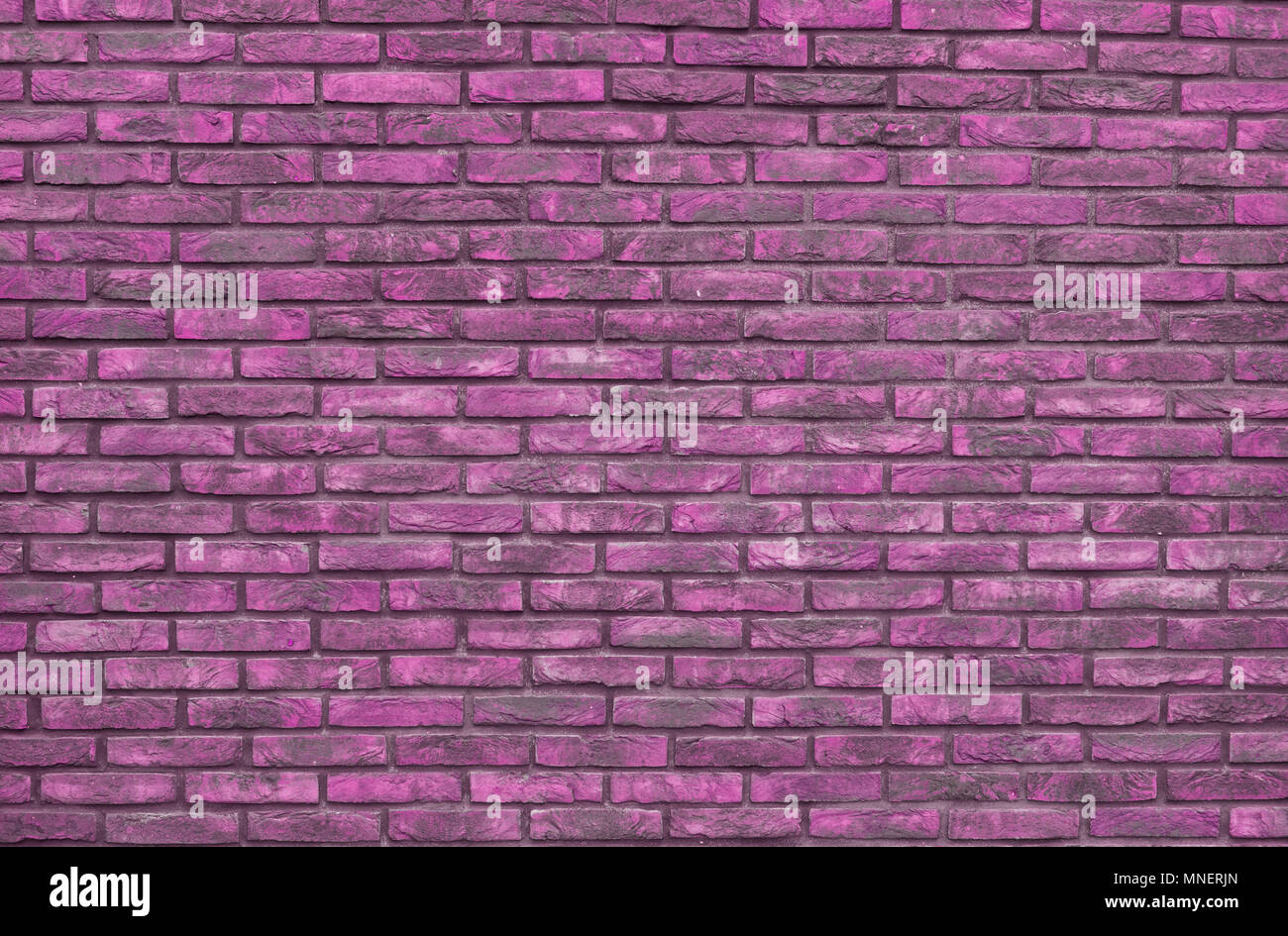 Vibrant pink brick wall background, wallpaper. Pink bricks pattern, texture. Stock Photo