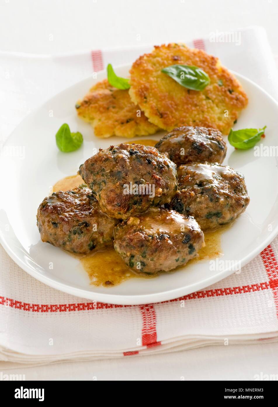 Polpettine speziate e frittelle di pane (spicy meatballs with bread fritters, Italy) Stock Photo