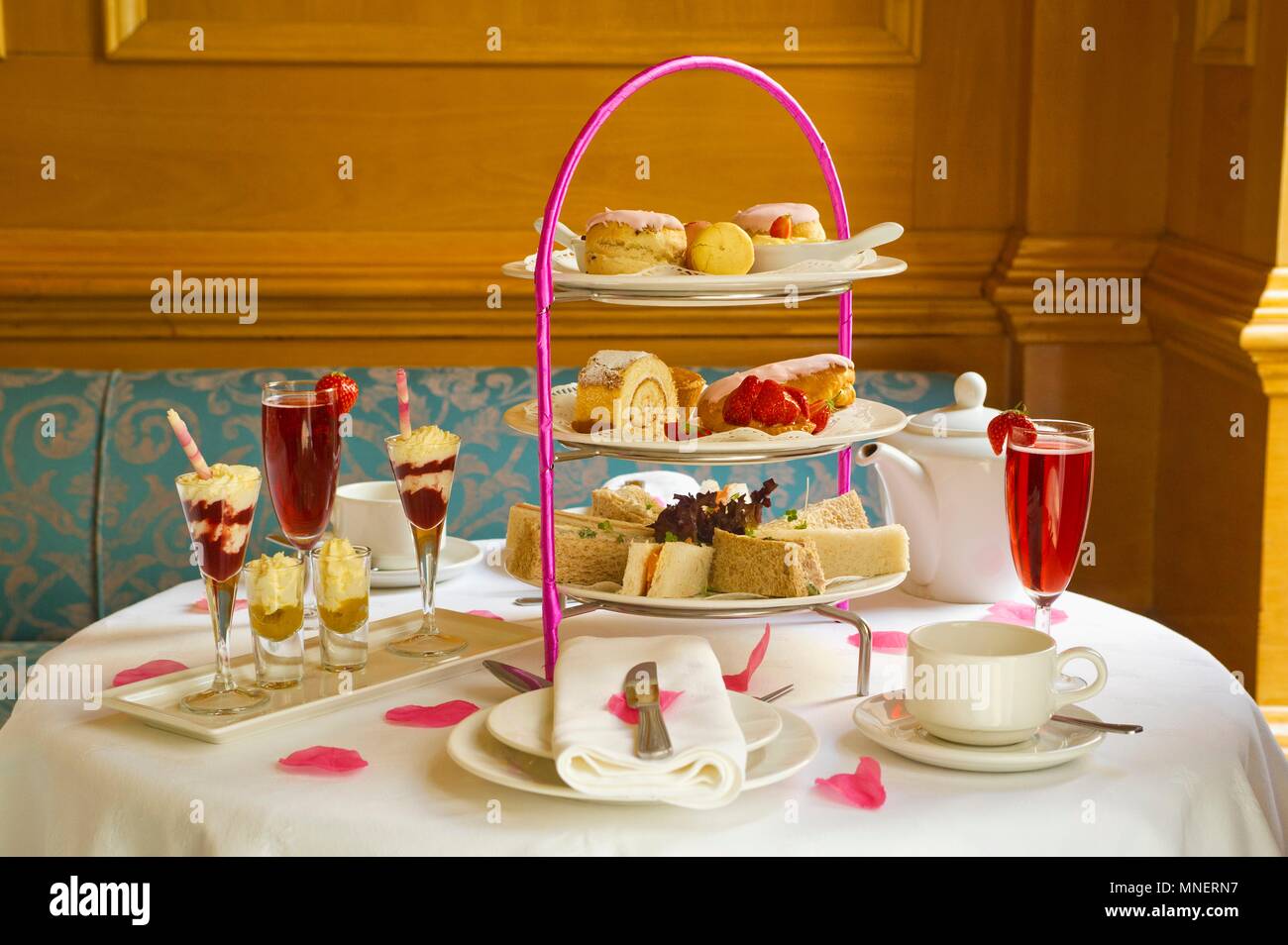 Cake, desserts, sandwiches and drinks for high tea Stock Photo Alamy