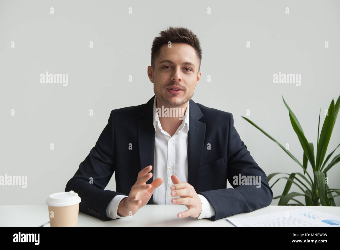 Confident CEO talking about company success strategy Stock Photo