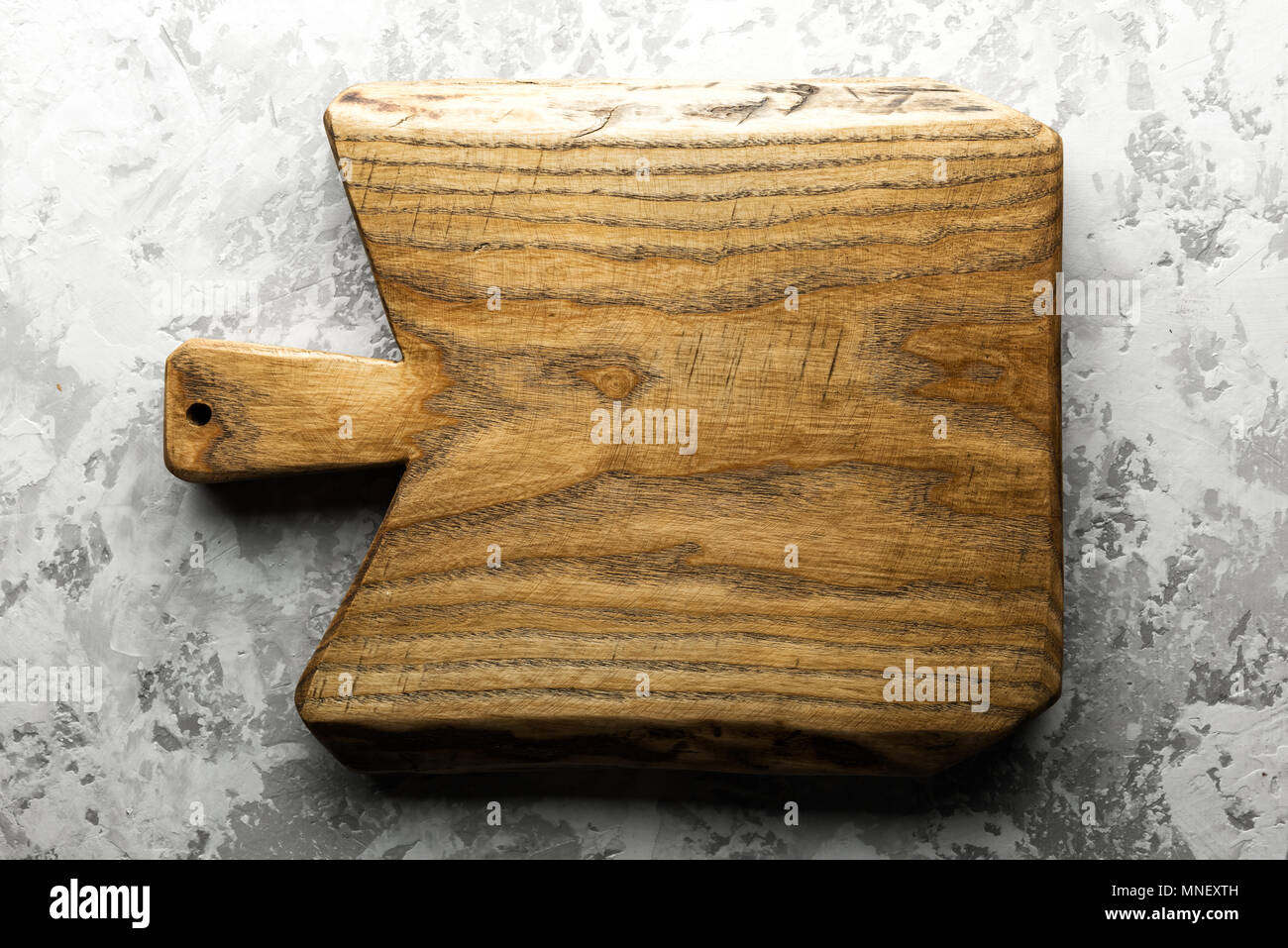 Old oak wood board on grunge concrete table Stock Photo