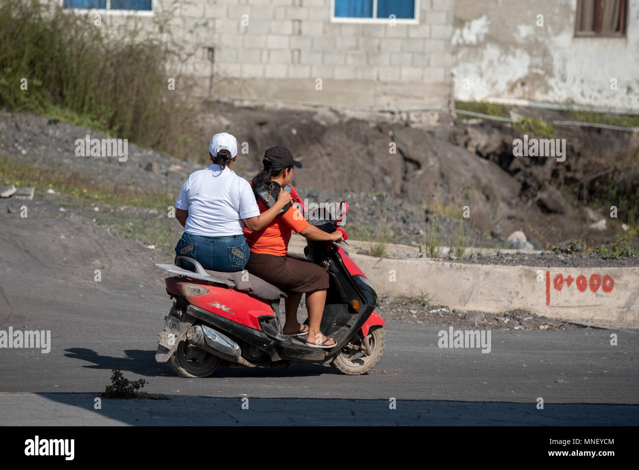 Women on a motor scooter in Puerto Villamil, Isabela Island, Galapagos  Islands, Ecuador Stock Photo - Alamy