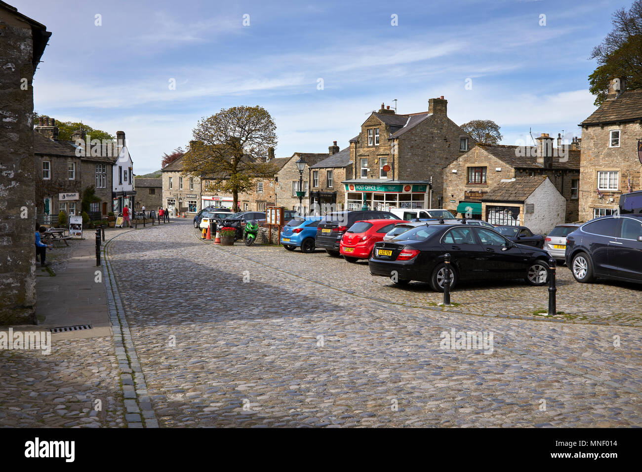 A sunny and inviting view of the village square of Grassington. Nr Skipton in Wharfedale, North Yorkshire Stock Photo