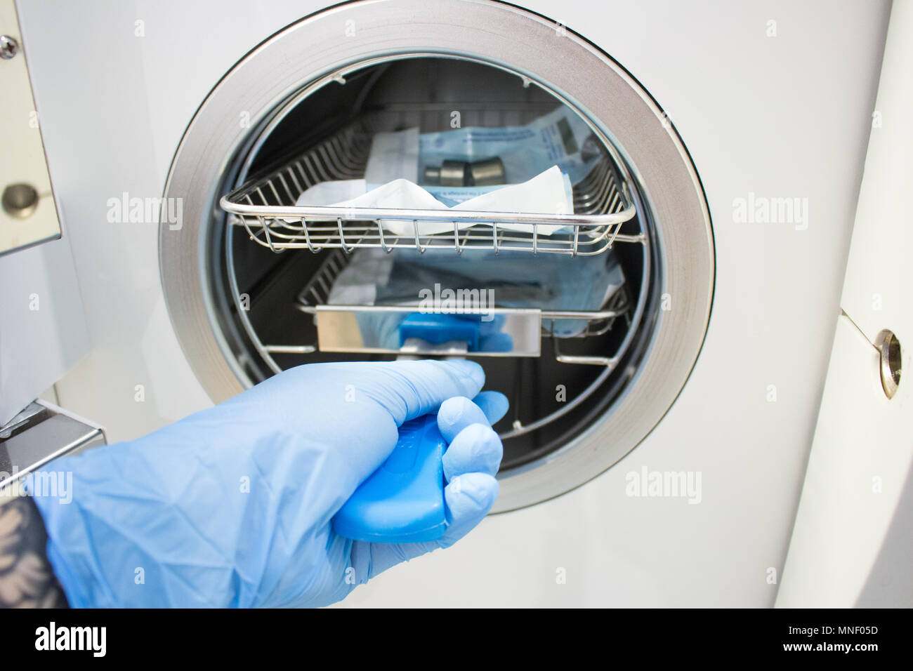 Sterilizing medical instruments in autoclave. Equipment for sterile  cleaning of working medical instruments Stock Photo - Alamy