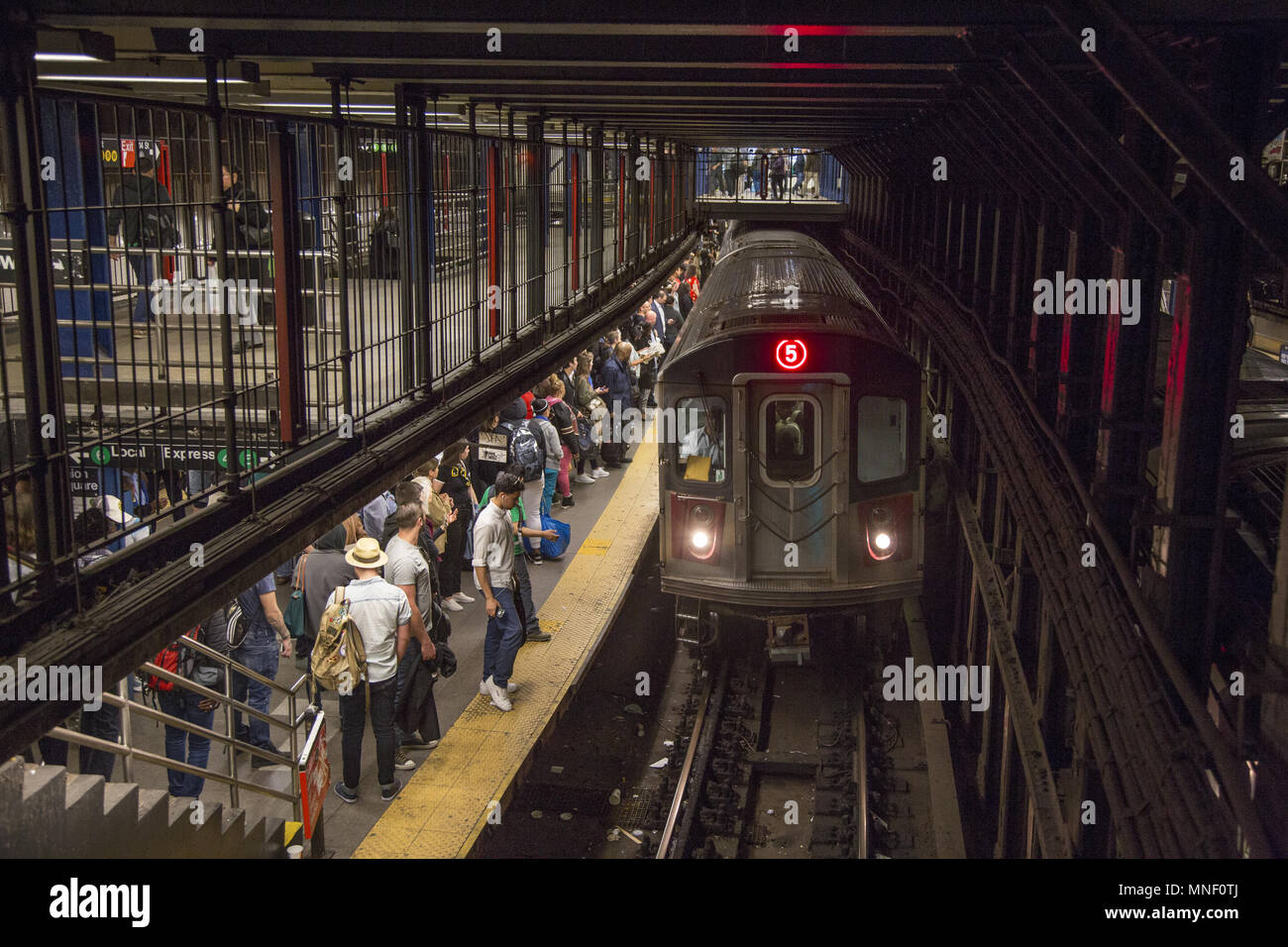 A #5 train pulls into the Union Square Station plaform at 14th Street in New York City. Stock Photo