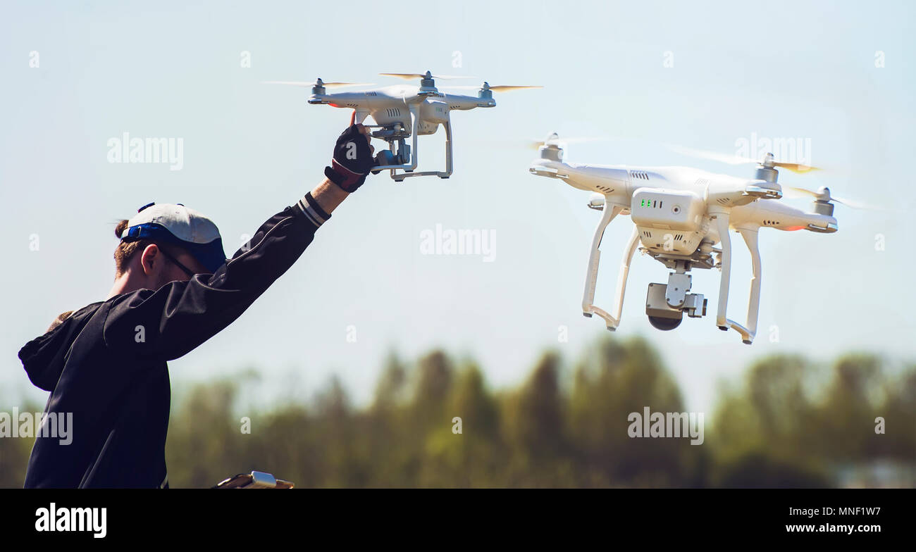 quadcopter in flight and in hand Stock Photo - Alamy