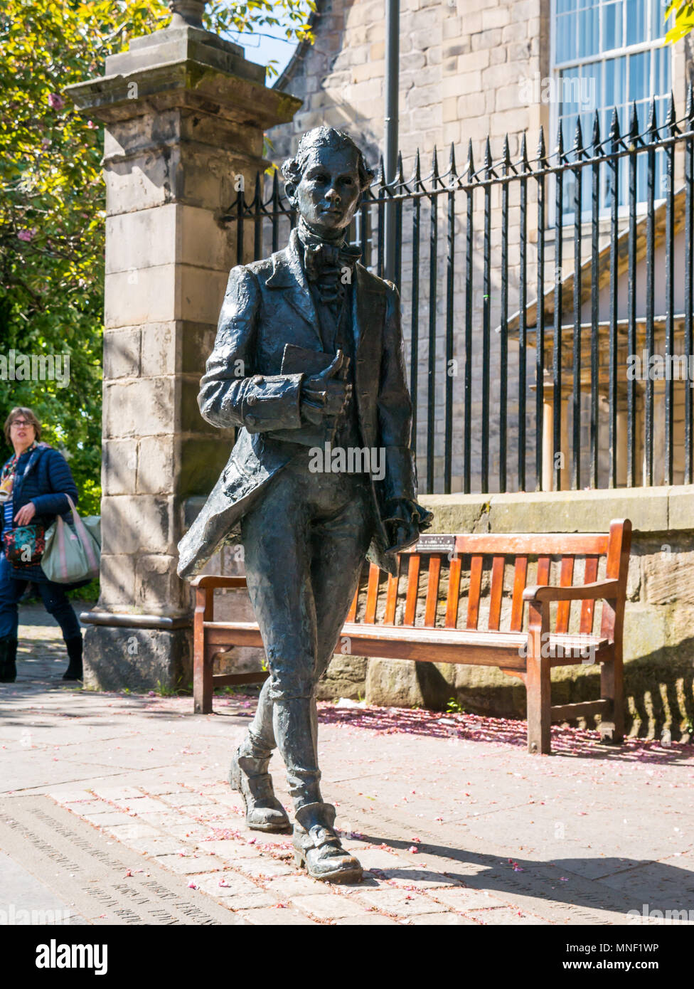 Bronze sculpture by David Annand of Robert Fergusson at Canongate Kirk