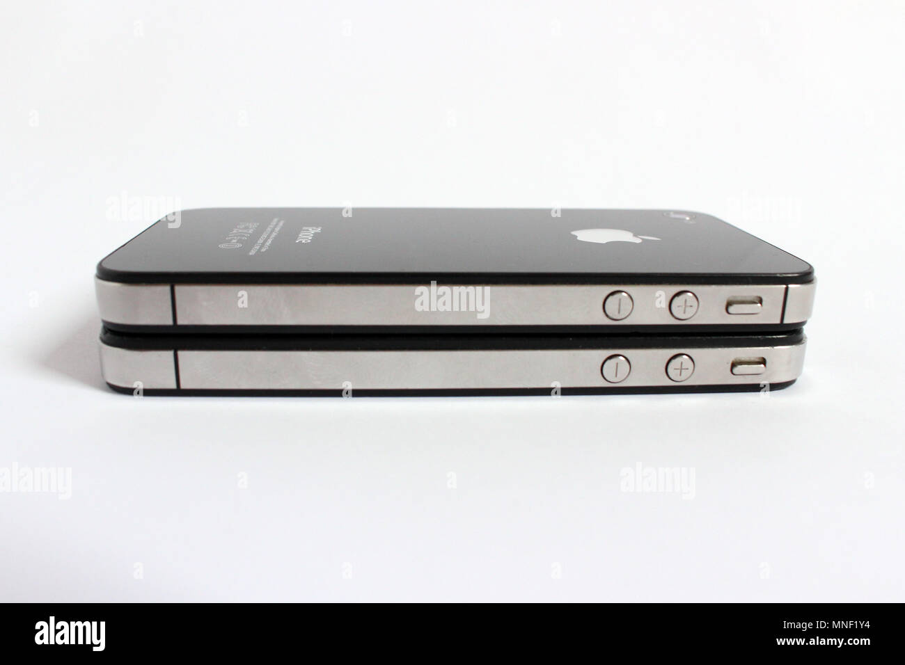 Iphone 4 and i-phone four s, twins smartphone, editorial Stock Photo
