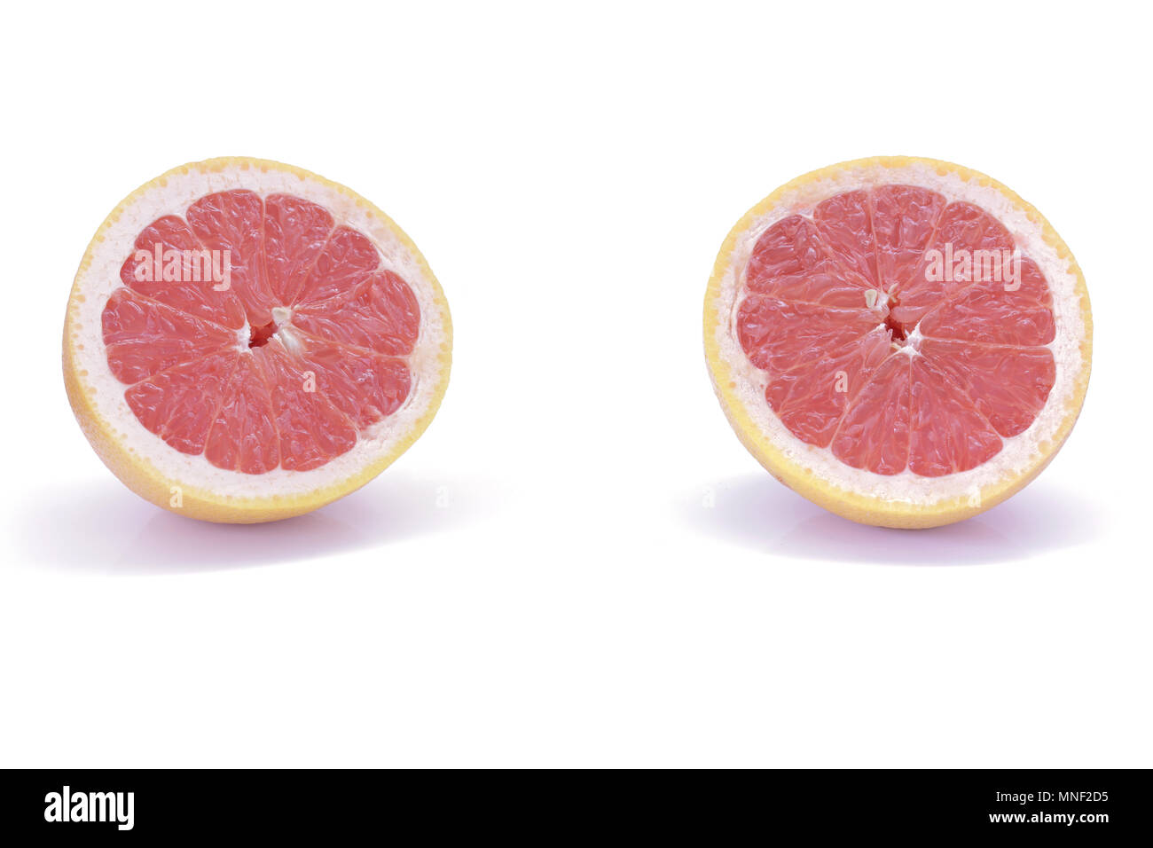 Sliced pink grapefruit isolated on white background Stock Photo