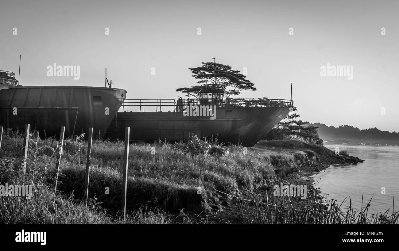dockyard with tugboats on Mahakam riverbank, Samarinda, Indonesia, in