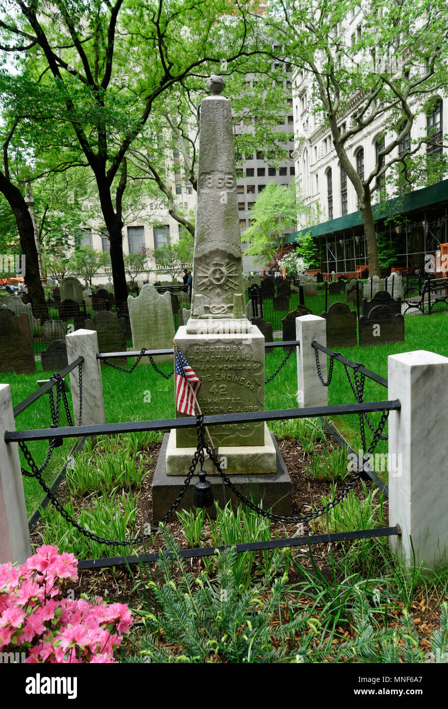 The Fireman’s Memorial Monument in Trinity Church’s Manhattan graveyard was erected in 1865 by volunteer firemen to honor their dead comrades. Stock Photo