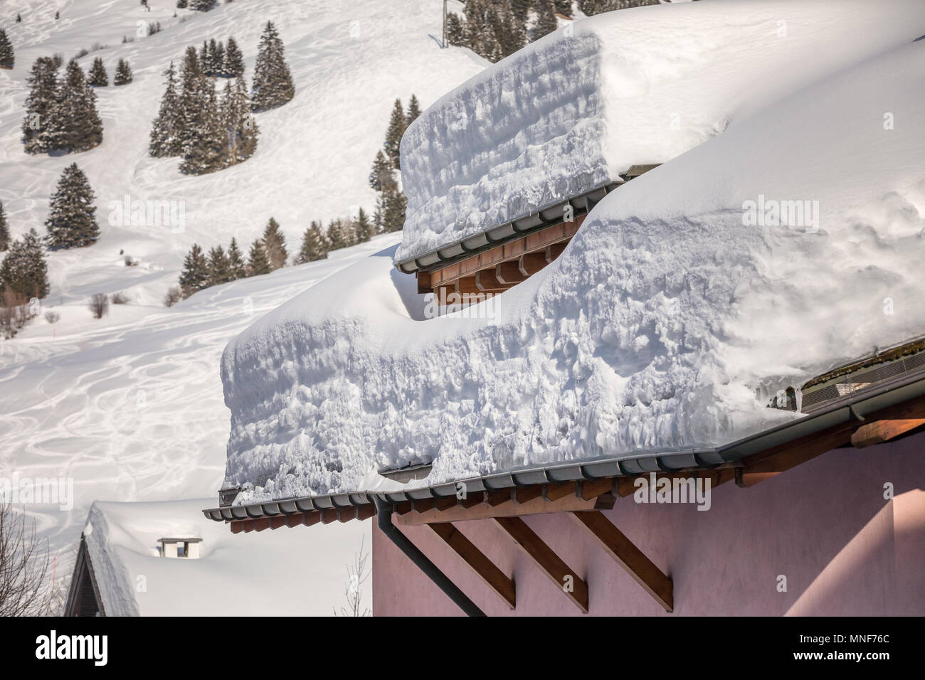 snow load on a roof in Switzerland Stock Photo
